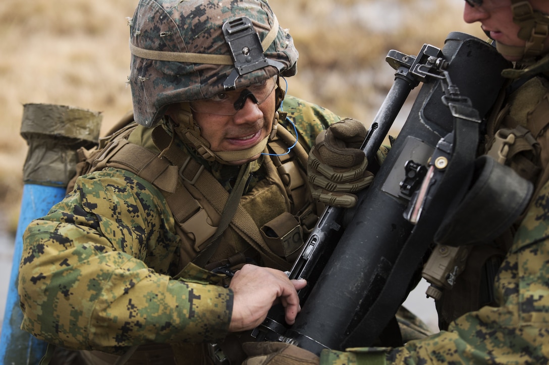 Marine disengages spotting rifle