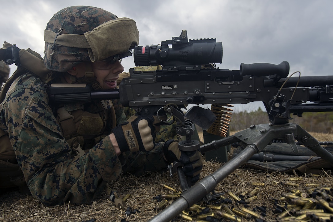 Marine fires an M240 machine gun during an exercise