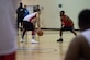 U.S. Air Force Tech. Sgt. Ameer Armoto, 633rd Medical Group NCO, in charge of ambulance services, dribbles a basketball while Brevin Lyons, Army and Air Force Exchange Service clerk, guards him during the intermural basketball championship game at the Shellbank Fitness Center, Joint Base Langley-Eustis, Va., Jan. 25, 2018.