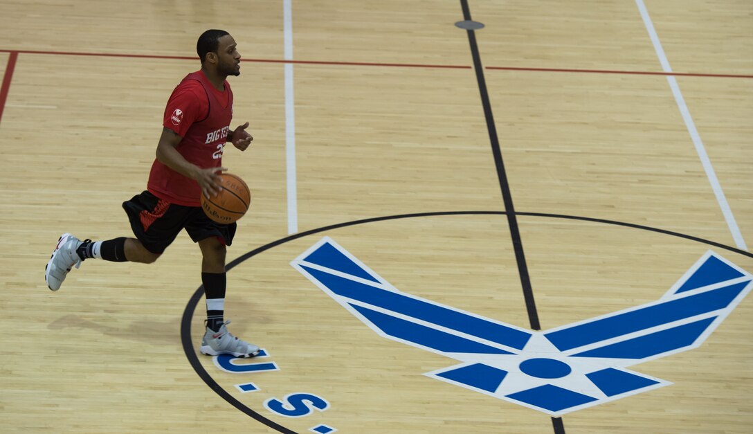 Kendrick Ward, 633rd Force Support Squadron education technician, dribbles a basketball down the court during the intermural basketball championship game at the Shellbank Fitness Center, Joint Base Langley-Eustis, Va., Jan. 25, 2018.