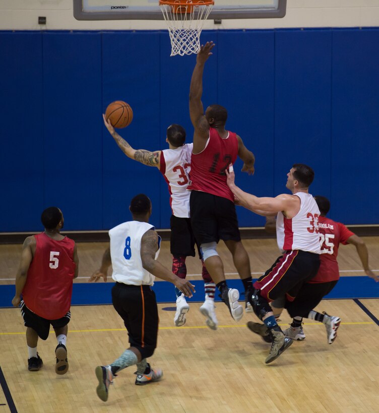 U.S. Air Force Tech. Sgt. Ameer Armoto, 633rd Medical Group NCO in charge of ambulance services, attempts a layup during the intermural basketball championship game at the Shellbank Fitness Center, Joint Base Langley-Eustis, Va., Jan. 25, 2018.