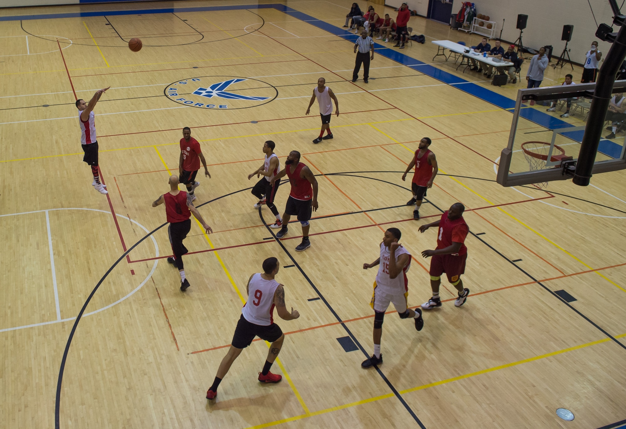 U.S. Air Force Tech. Sgt. Ameer Armoto, 633rd Medical Group NCO in charge of ambulance services, shoots a basket during the intermural basketball championship game at the Shellbank Fitness Center, Joint Base Langley-Eustis, Va., Jan. 25, 2018.