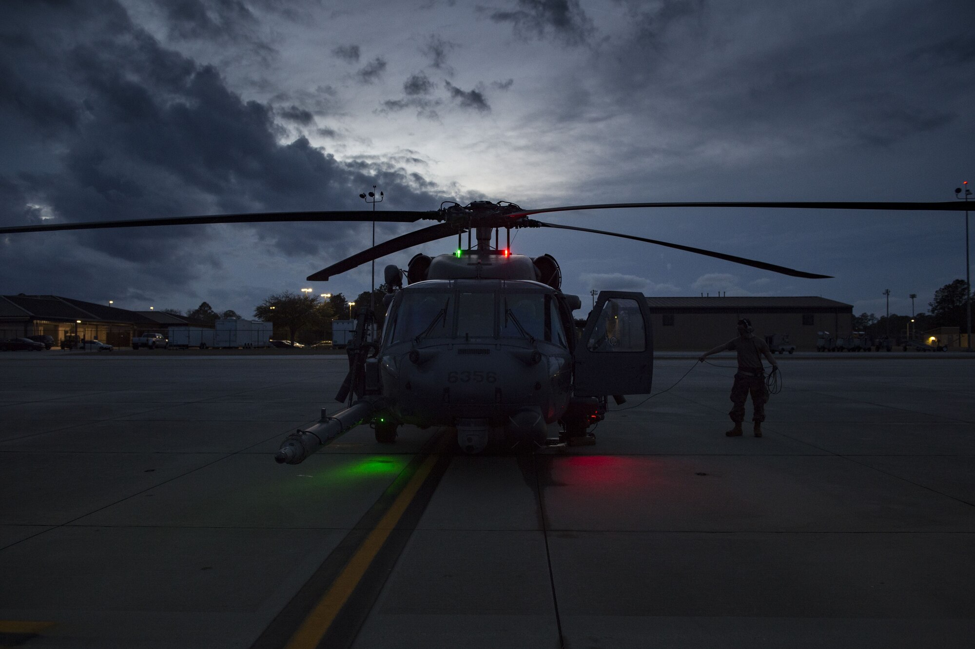 Airmen perform maintenance checks on an HH-60G Pave Hawk, Jan. 22, 2018, at Moody Air Force Base, Ga. The 41st RQS is responsible for maintaining combat-ready personnel for recovery missions. To achieve this, members of the squadron constantly train on day and nighttime operations to maintain proficiency. (U.S. Air Force photo by Senior Airman Janiqua P. Robinson)