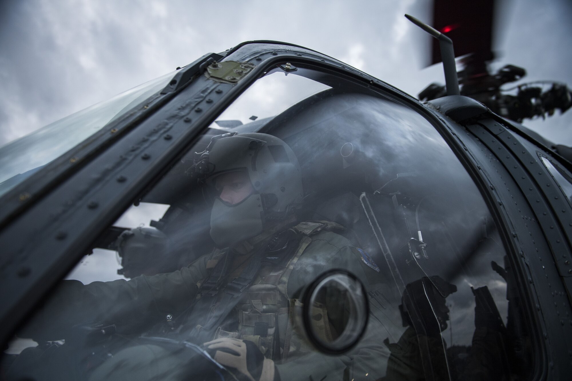 A pilot from the 41st Rescue Squadron starts the rotors an HH-60G Pave Hawk, Jan. 22, 2018, at Moody Air Force Base, Ga. The 41st RQS is responsible for maintaining combat-ready personnel for recovery missions. To achieve this, members of the squadron constantly train on day and nighttime operations to maintain proficiency. (U.S. Air Force photo by Senior Airman Janiqua P. Robinson)