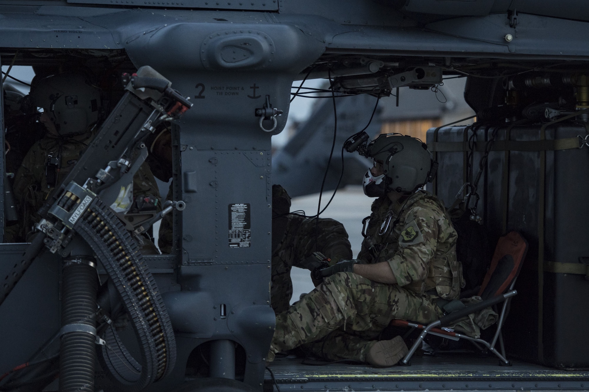 An Airman from the 41st Rescue Squadron performs preflight checks, Jan. 22, 2018, at Moody Air Force Base, Ga. The 41st RQS is responsible for maintaining combat-ready personnel for recovery missions. To achieve this, members of the squadron constantly train on day and nighttime operations to maintain proficiency. (U.S. Air Force photo by Senior Airman Janiqua P. Robinson)