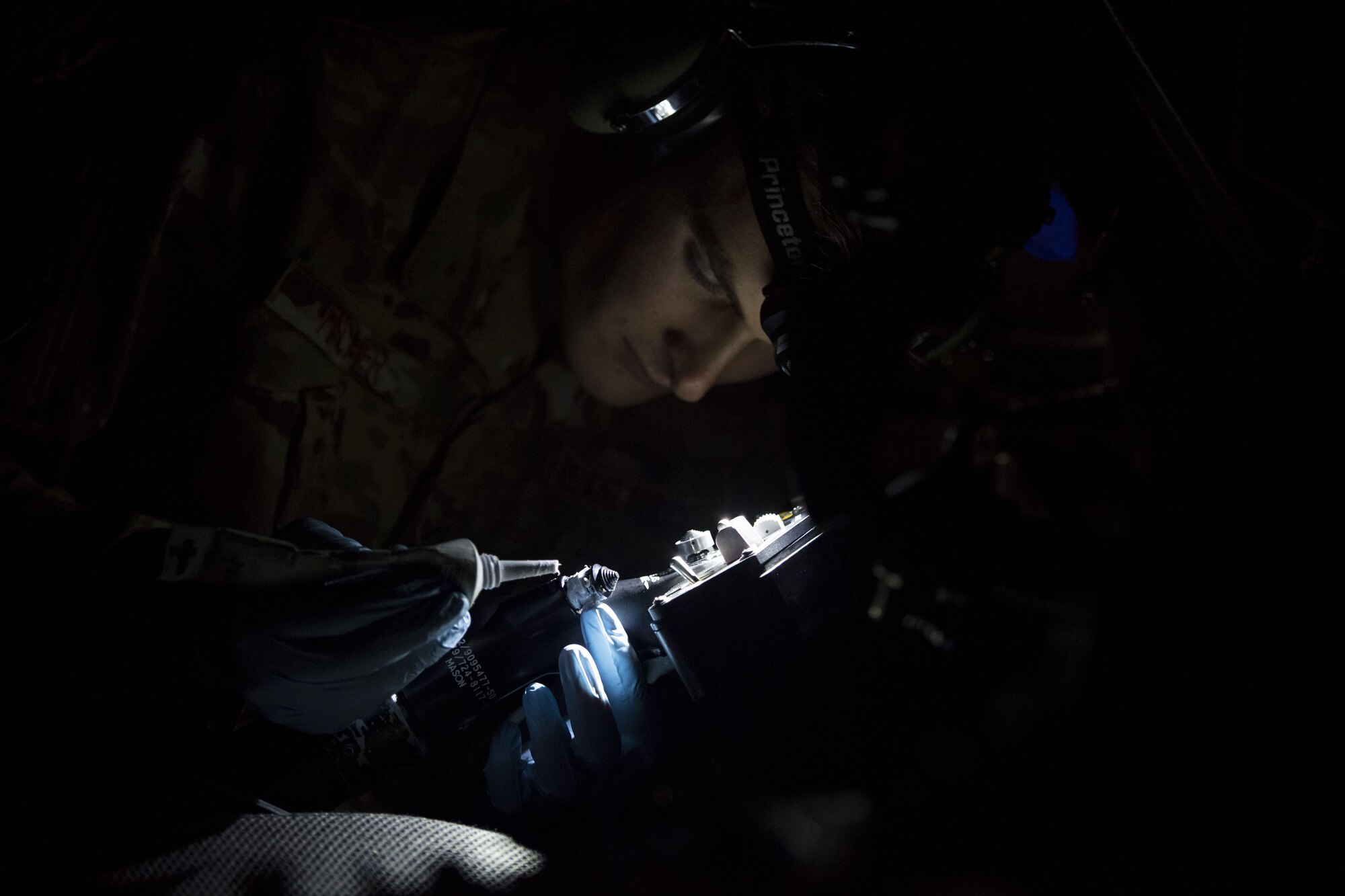 An Airman from the 41st Helicopter Maintenance Unit performs maintenance on an HH-60G Pave Hawk, Jan. 22, 2018, at Moody Air Force Base, Ga. The 41st RQS is responsible for maintaining combat-ready personnel for recovery missions. To achieve this, members of the squadron constantly train on day and nighttime operations to maintain proficiency. (U.S. Air Force photo by Senior Airman Janiqua P. Robinson)