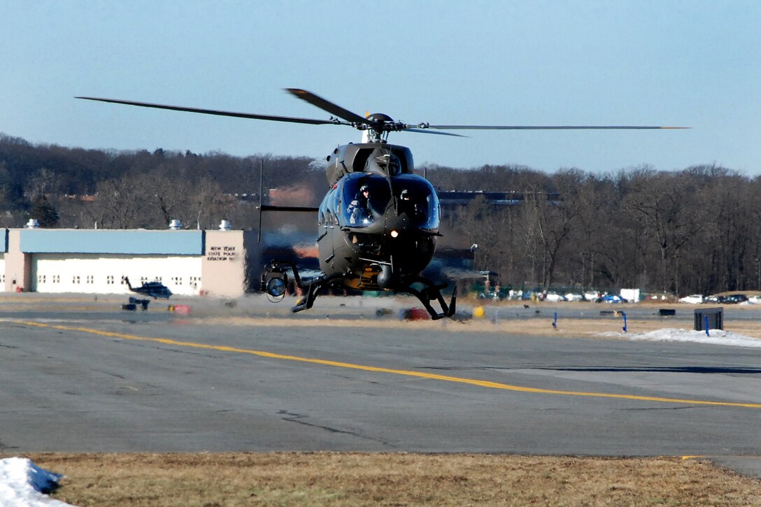 An Army pilot prepares to land a UH-72 Lakota helicopter.