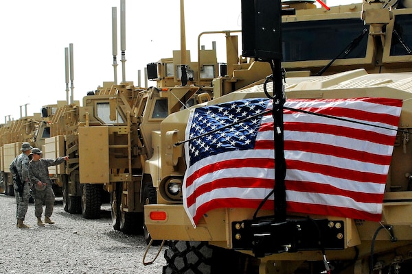 Mine resistant ambush protected vehicles sit in a row at the Camp Liberty MRAP fielding site, Feb. 20, the day a ceremony was held there to celebrate the introduction of the 10,000th vehicle into the Iraq Theater of Operations.