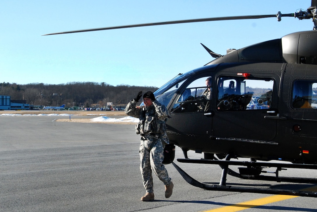 A soldier walks away from a UH-72 Lakota helicopter.