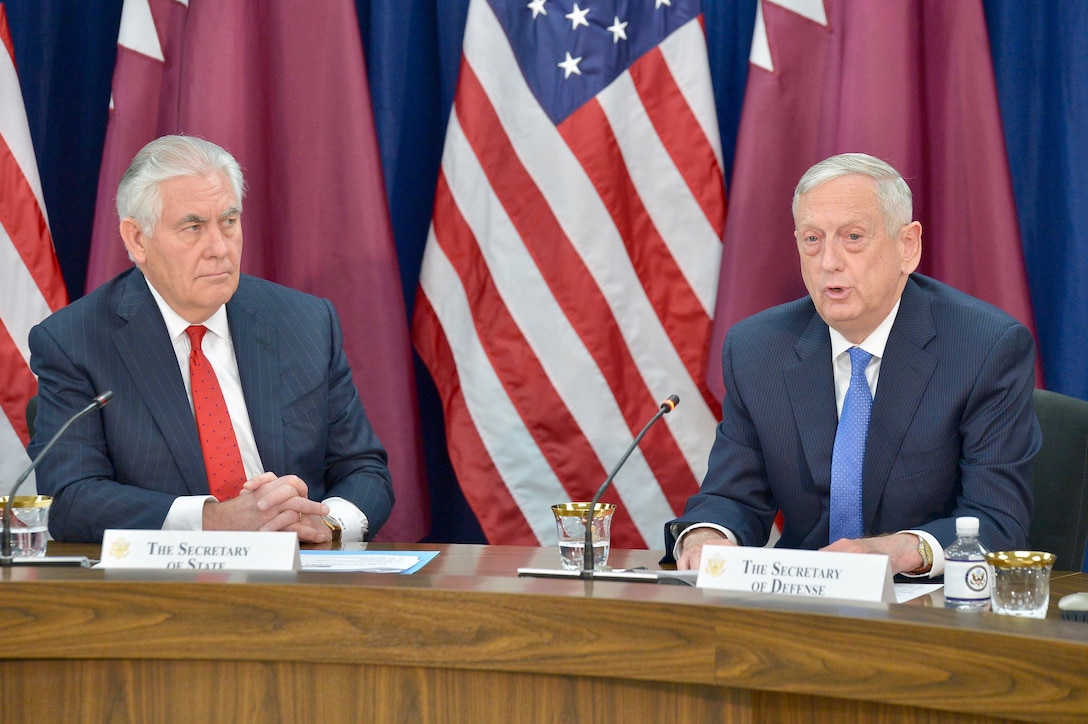 Defense Secretary James N. Mattis, flanked by Secretary of State Rex W. Tillerson, delivers remarks at the opening session of the inaugural U.S.-Qatar Strategic Dialogue at the State Department in Washington.