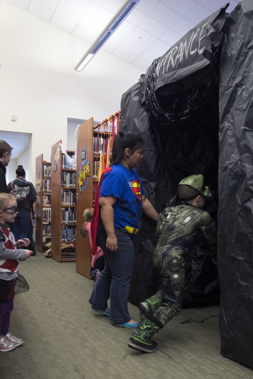 Children run through three obstacle courses built between book shelves at the Joint Base Elmendorf-Richardson Library during the 4th Annual Comic Con, Jan. 27, 2018. The event included cosplay, a trivia contest, arts and crafts, and many more activities.