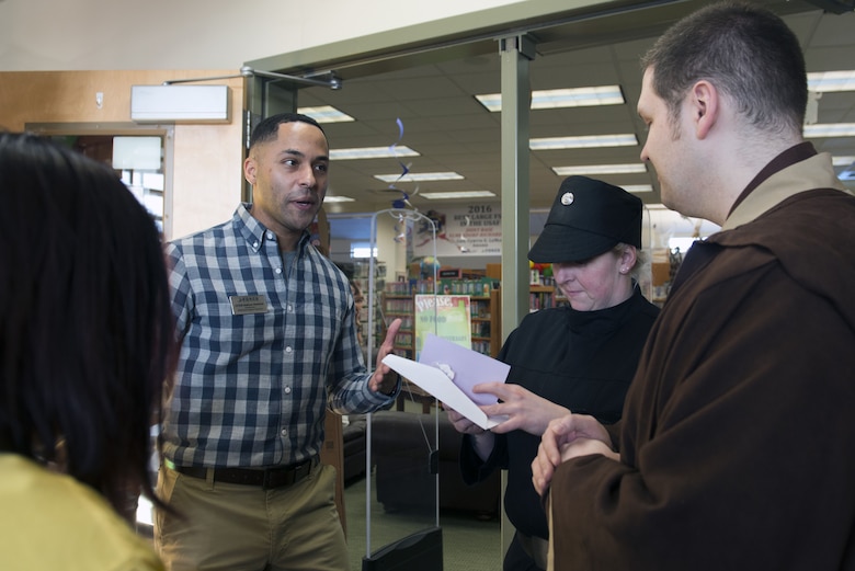 Air Force Lt. Col. Joshua Hawkins, 673d Force Support Squadron commander, leads the Jay Bear’s Surprize Squad by handing out a gift card to a randomly selected patron during the Joint Base Elmendorf-Richardson Library 4th Annual Comic Con, Jan. 27, 2018. The event included cosplay, a trivia contest, arts and crafts, and many more activities.