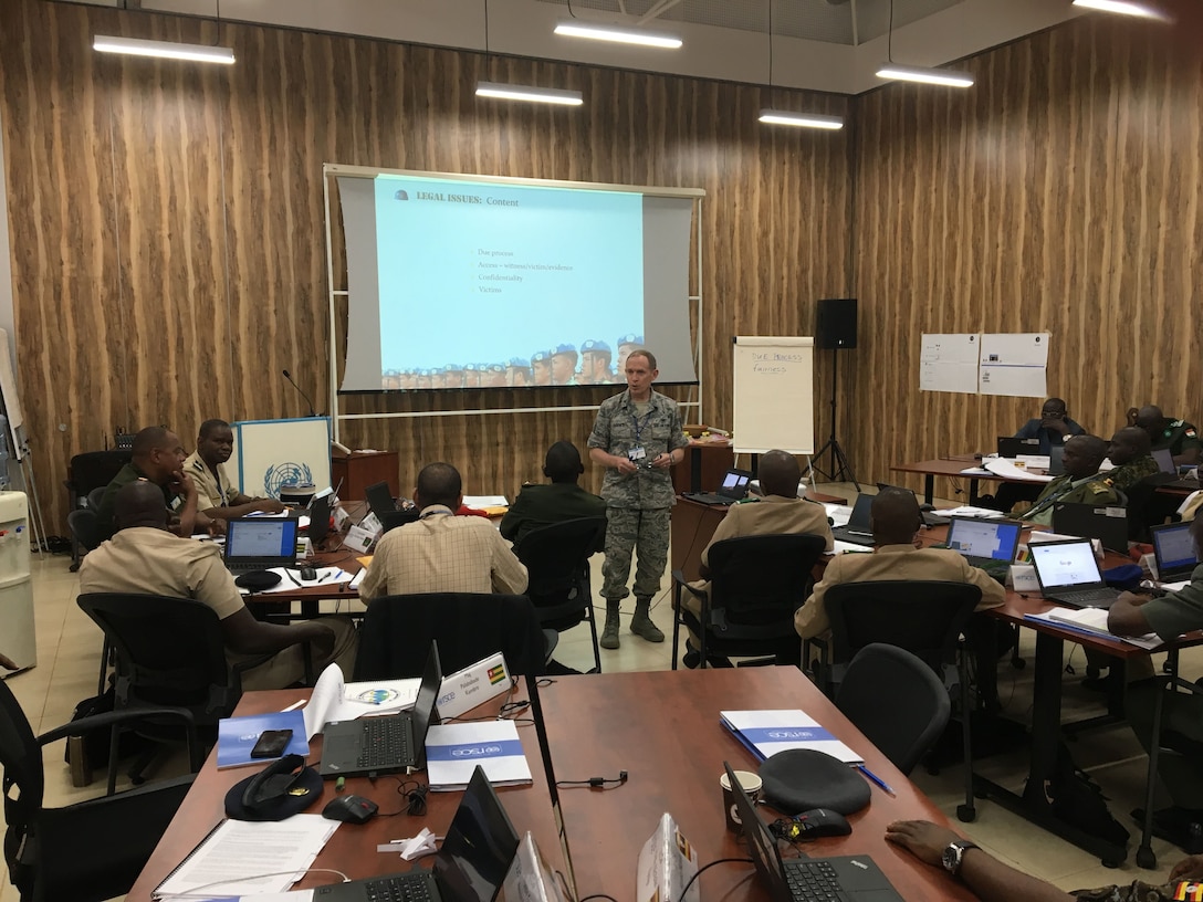 The director of the Defense Institute of International Legal Studies, Air Force Col. Kirk Davies, provides instruction at the inaugural training course for national investigative officers for U.N. peacekeeping operations, aimed at holding peacekeepers accountable for abuses such as sexual misconduct and preventing further crimes, Entebbe, Uganda.
