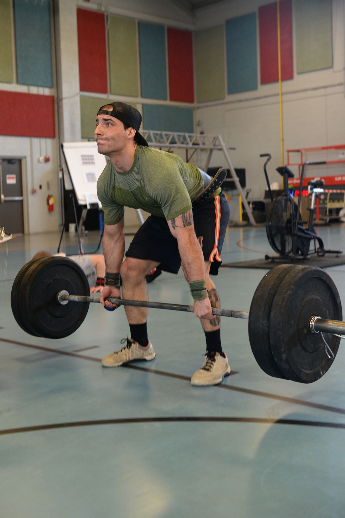 U.S. Navy Petty Officer 2nd Class Joseph Gutierrez, Maritime Security Task Force sonar technician (submarine), executes a deadlift in Fort Eustis' Anderson Field House at Joint Base Langley-Eustis, Va., Jan. 27, 2018.