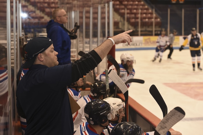 Maj. Ryan Whitaker, Charleston Patriots coach, directs members of the Patriots during the Fourth Annual Deputy Joe Matuskovic Memorial Hockey Game between the Charleston Patriots and Charleston Enforcers at the North Charleston Coliseum, Jan. 27, 2018.
