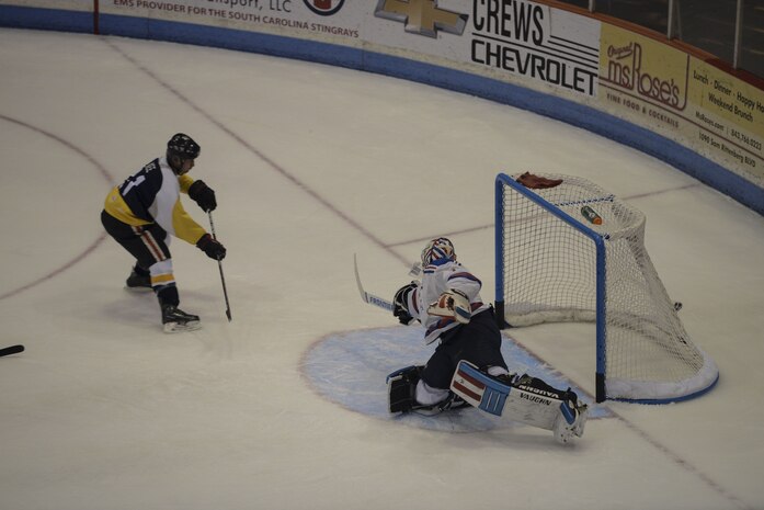 A Charleston Enforcer makes a goal against the Charleston Patriot's goalie during the Fourth Annual Deputy Joe Matuskovic Memorial Hockey Game at the North Charleston Coliseum, Jan. 27, 2018.