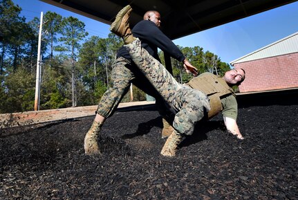 U.S. Marine Corps Staff Sgt. James Benson, left, and Staff Sgt. Justin Golden, both of Detachment 3 Supply Company, Combat Logistics Battalion 451, practice martial arts techniques during a Marine Martial Arts Program demonstration Jan. 25, at the U.S. Marine Corps Reserve Training Center at Joint Base Charleston’s Naval Weapons Station, S.C. The MCMAP is designed to increase a Marine’s warfighting capability and self-confidence and is based off the principle that every Marine is a rifleman. The MCMAP focuses on the physical, mental and character disciplines essential for a Marine to be successful in the program.