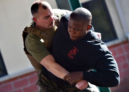 U.S. Marine Corps Staff Sgt. James Benson, right, and Staff Sgt. Justin Golden, both of Detachment 3 Supply Company, Combat Logistics Battalion 451, practice martial arts techniques during a Marine Martial Arts Program demonstration Jan. 25, at the U.S. Marine Corps Reserve Training Center at Joint Base Charleston’s Naval Weapons Station, S.C. The MCMAP is designed to increase a Marine’s warfighting capability and self-confidence and is based off the principle that every Marine is a rifleman. The MCMAP focuses on the physical, mental and character disciplines essential for a Marine to be successful in the program.