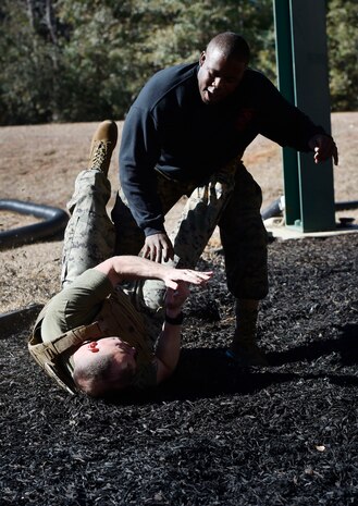 U.S. Marine Corps Staff Sgt. James Benson, top, and Staff Sgt. Justin Golden, both of Detachment 3 Supply Company, Combat Logistics Battalion 451, practice martial arts techniques during a Marine Martial Arts Program demonstration Jan. 25, at the U.S. Marine Corps Reserve Training Center at Joint Base Charleston’s Naval Weapons Station, S.C. The MCMAP is designed to increase a Marine’s warfighting capability and self-confidence and is based off the principle that every Marine is a rifleman. The MCMAP focuses on the physical, mental and character disciplines essential for a Marine to be successful in the program.