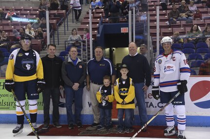 Joint Base Charleston leadership participates in the initial puck drop during the Fourth Annual Deputy Joe Matuskovic Memorial Hockey Game between the Charleston Patriots and Charleston Enforcers at the North Charleston Coliseum, Jan. 27, 2018.