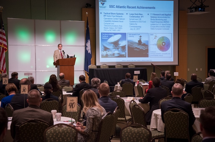 Space and Naval Warfare Systems Center (SSC) Atlantic Executive Director Chris Miller discusses recent achievements at SSC Atlantic during the Charleston Defense Contractors Association’s 45th quarterly Small Business and Industry Outreach Initiative (SBIOI) Symposium. SSC Atlantic develops, acquires and provides life cycle support for command, control, communications, computer, intelligence, surveillance and reconnaissance (C4ISR) systems, information technology and space capabilities. A leading-edge Navy engineering center, SSC Atlantic designs, builds, tests, fields and supports many of the finest frontline C4ISR systems in use today, and those being planned for the future.