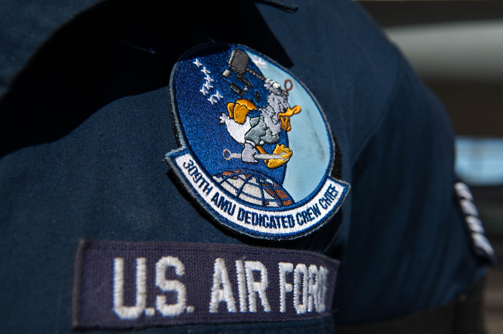Staff Sgt. Drake Keske, 309th Aircraft Maintenance Unit dedicated crew chief, wears his 309th AMU DCC patch at Luke Air Force Base, Ariz., Jan. 25, 2018. DCCs are selected based on a number of qualities to include initiative, leadership and technical knowledge of their assigned aircraft. (U.S. Air Force photo/Airman 1st Class Alexander Cook)