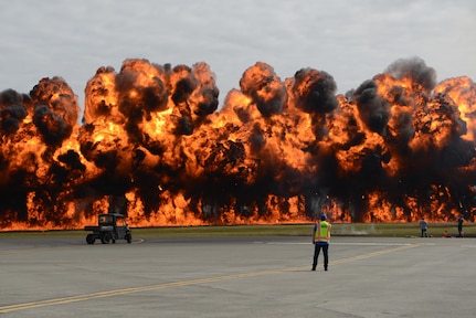 Pyrotechnics forming a wall of fire accompany the Joint Forces Demonstration during the Arctic Thunder Open House at Joint Base Elmendorf-Richardson, Alaska, July 1, 2018. During the biennial open house, JBER opens its gates to the public and hosts multiple performers including the U.S. Air Force Thunderbirds, JBER Joint Forces Demonstration and the U.S. Air Force F-22 Raptor Demonstration Team.