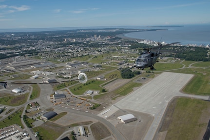 An Air Force HH-60G Pave Hawk prepares to demonstrate in-flight refueling from an  HC-130J Combat King II during the joint forces demonstration at the Arctic Thunder Open House, July 1, 2018. This biennial event hosted by Joint Base Elmendorf-Richardson, Alaska, is one of the largest in the state and one of the premier aerial demonstrations in the world. The event features multiple performers and ground acts to include the JBER joint forces, U.S. Air Force F-22, and U.S. Air Force Thunderbirds demonstrations teams, June 30-July 1.