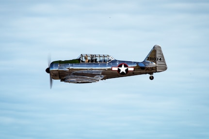 A BT-13 Valiant pilot performs an aerial display during the Arctic Thunder Open House on Joint Base Elmendorf-Richardson, Alaska, July 1, 2018. During the biennial open house, JBER opens its gates to the public and hosts multiple performers including the U.S. Air Force Thunderbirds, JBER Joint Forces Demonstration and the U.S. Air Force F-22 Raptor Demonstration Team.