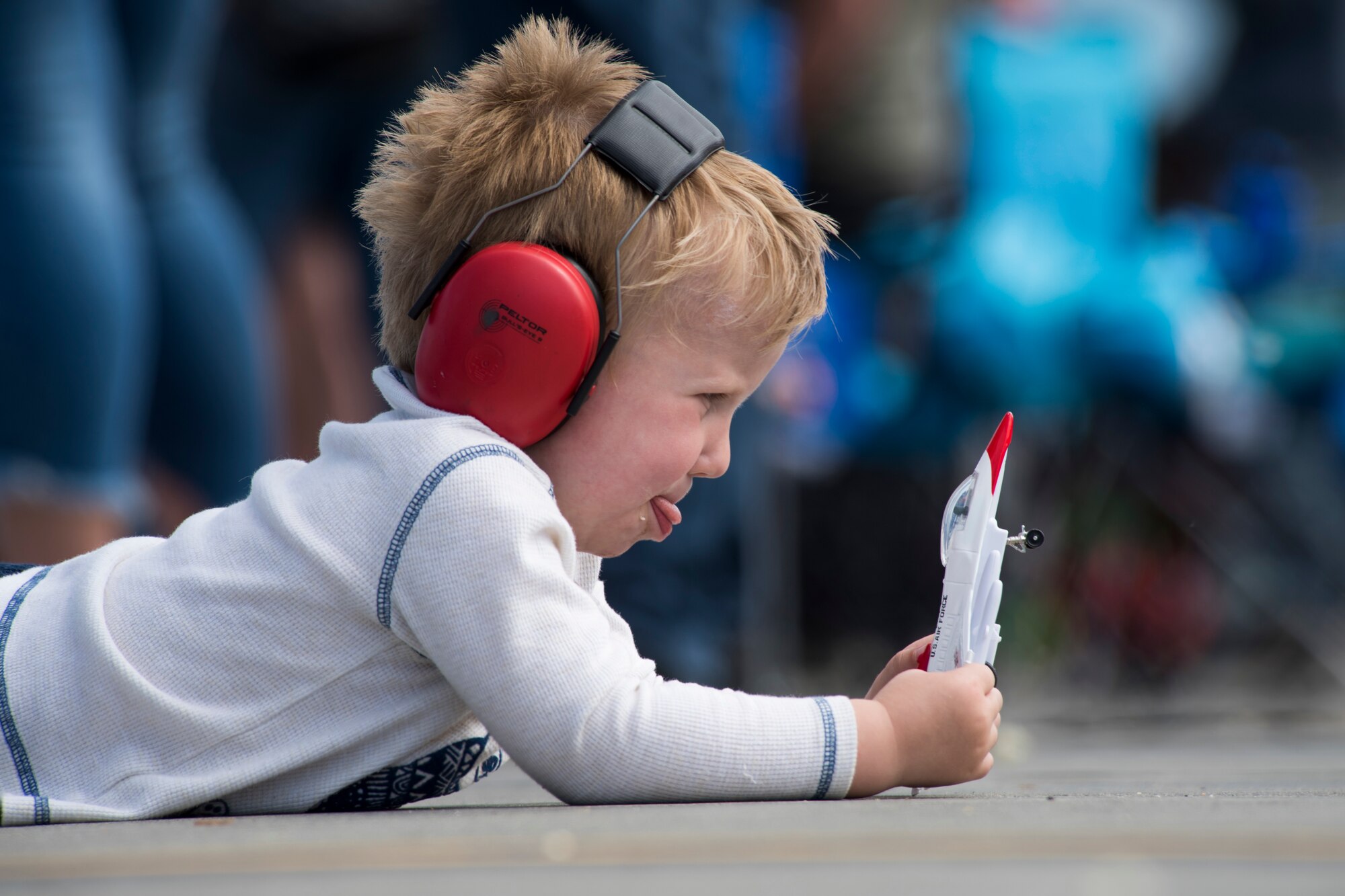 Owen, 4, plays with an F-16 Fighting Falcon model during the Arctic Thunder Open House at Joint Base Elmendorf-Richardson, Alaska, July 1, 2018. During the biennial open house, JBER opens its gates to the public and hosts multiple performers including the U.S. Air Force Thunderbirds, JBER Joint Forces Demonstration and the U.S. Air Force F-22 Raptor Demonstration Team.