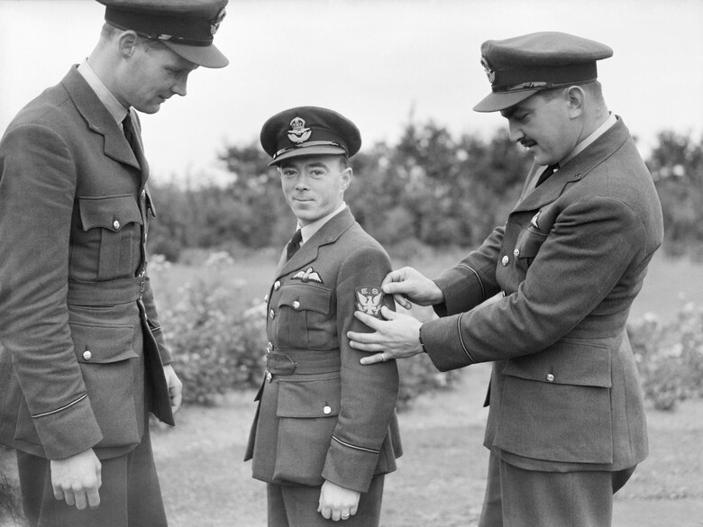 Three American pilots of the No. 71 (Eagle) Squadron Royal Air Force show off their new squadron badge at Church Fenton, Yorkshire, Oct. 1940. Three ‘eagle squadrons’ were formed between 1940 and 41 from U.S. citizens in the RAF. Initially they had British commanding officers, a combination of U.S. and British pilots and British ground crew. (Courtesy Photo)