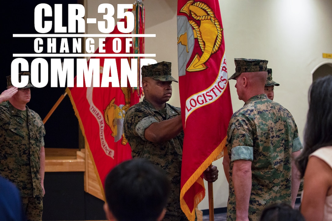 Lt. Col. Kenric D. Stevenson (center), outgoing commanding officer of Combat Logistics Regiment 35, 3rd Marine Logistics Group takes hold of the regimental colors to pass to the incoming commanding officer during a change of command ceremony July 2, 2018 on Camp Kinser, Okinawa, Japan. Stevenson relinquished command of CLR-35 to Col. Joon H. Um. Stevenson is a native of DeRidder, Louisiana. Um is a native of Tampa, Florida. (U.S. Marine Corps photo by Cpl. Joshua S. Pinkney)