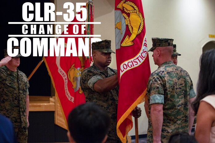 Lt. Col. Kenric D. Stevenson (center), outgoing commanding officer of Combat Logistics Regiment 35, 3rd Marine Logistics Group takes hold of the regimental colors to pass to the incoming commanding officer during a change of command ceremony July 2, 2018 on Camp Kinser, Okinawa, Japan. Stevenson relinquished command of CLR-35 to Col. Joon H. Um. Stevenson is a native of DeRidder, Louisiana. (U.S. Marine Corps photo by Cpl. Joshua S. Pinkney)