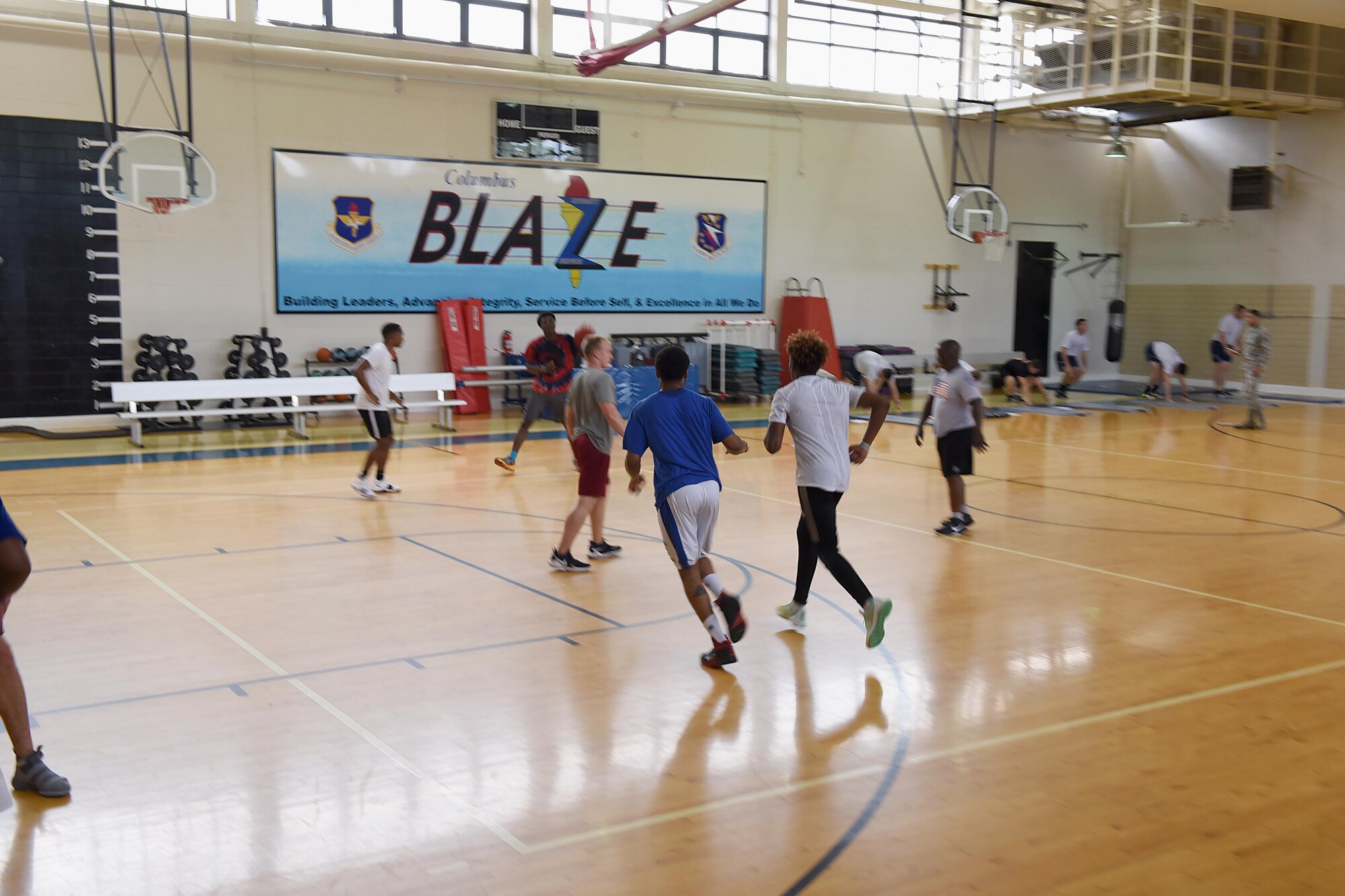 Team BLAZE members play basketball and workout in the Fitness Center June 19, 2018, on Columbus Air Force Base, Mississippi. The 14th Force Support Squadron keeps the quality-of-life for Airmen and their families high so together they can produce pilots, advance Airmen and feed the fight. (U.S. Air Force photo by Airman 1st Class Keith Holcomb)