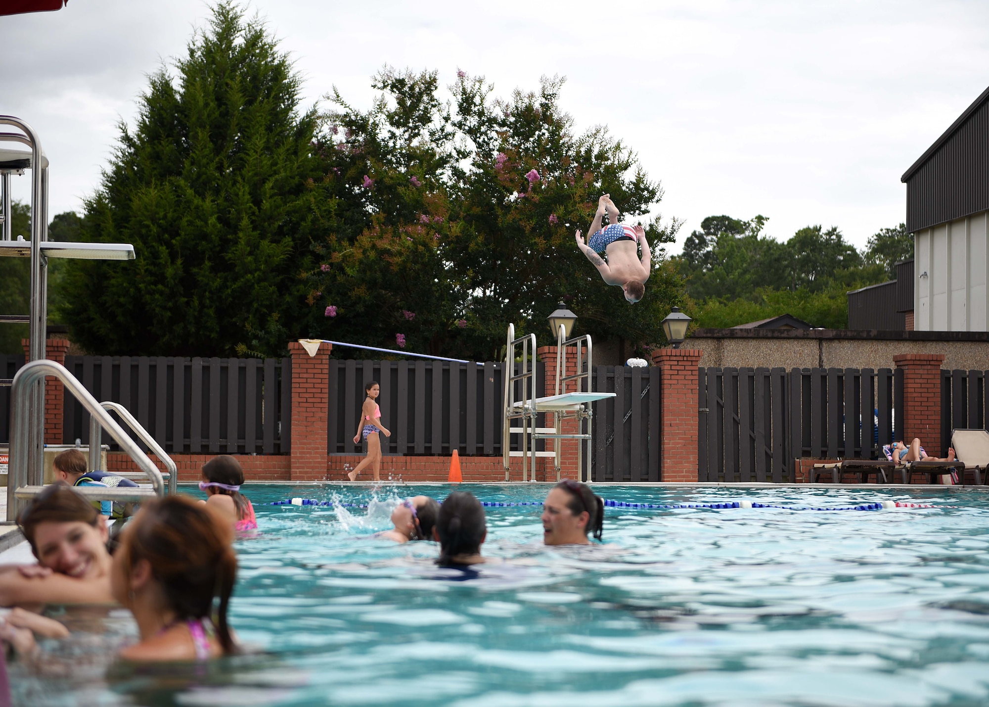 Airman 1st Class Ty Sawyer, 14th Civil Engineer Squadron firefighter, preforms a front flip June 20, 2018, on Columbus Air Force Base, Mississippi. The 14th FSS provides many quality-of-life facilities to help families and individuals comfortably grow professionally and personally. (U.S. Air Force photo by Airman 1st Class Keith Holcomb)