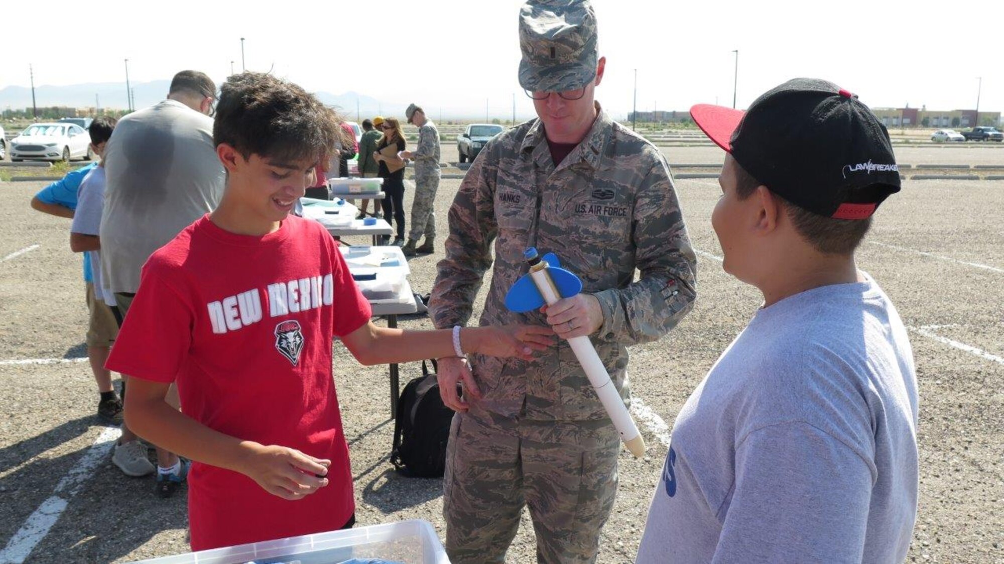 Air Force Research Laboratory scientist 1st Lt. Simeon Hanks through the AFRL STEM Outreach program mentors students getting ready for the Team America Rocket Competition.