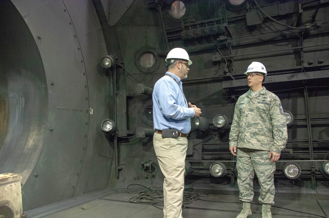 Jason Austin, director of AEDC Public Affairs, gives Chief Master Sgt. Robert Heckman, AEDC Superintendent, a tour of the test facilities at Arnold Air Force Base. Heckman recently started in his new role at Arnold, previously serving as superintendent of the 460th Operations Group, headquartered at Buckley AFB, Colorado. As AEDC Superintendent, Heckman will be an advisor to AEDC Commander Col. Scott Cain on all issues regarding operations, readiness, morale, good order and discipline at the Complex. (U.S. Air Force photo/Christopher Warner)