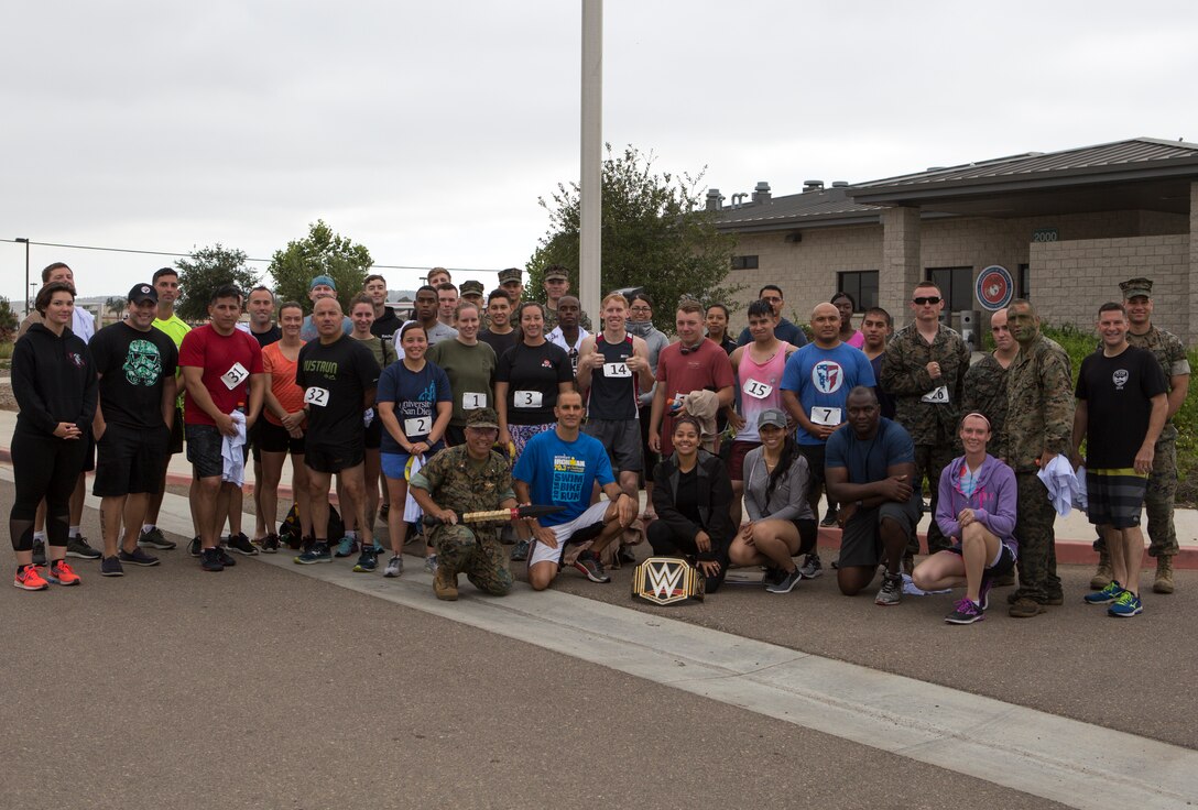 Marines and Sailors pose for a photo following the Aquathon at Marine Corps Air Station Miramar, Calif., June 29. Headquarters and Headquarters Squadron hosted the Aquathon as June’s Warrior Challenge, a run-swim-run team competition between active duty service members at MCAS Miramar. (U.S. Marine Corps photo by Cpl. Becky Cleveland)