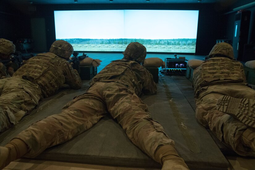 U.S. Army Soldiers qualify with the M4 carbine at the Engagement Skills Trainer during U.S. Army Central's 2018 Best Warrior Competition at Camp Buehring, Kuwait, June 29, 2018. The Best Warrior Competition promotes morale and cohesion and reinforces importance of individual excellence.