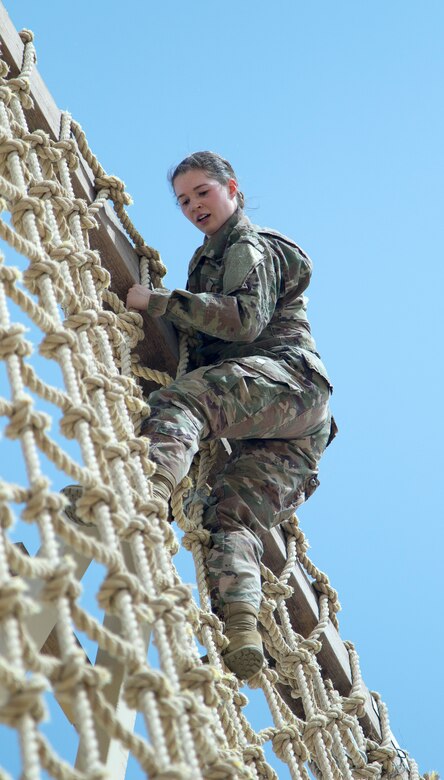 U. S. Army Spc. Emma Gebrosky, an intelligence analyst assigned to the 28th Infantry Division, climbs down the High Rope Wall during U.S. Army Central's 2018 Best Warrior Competition at Camp Buehring, Kuwait, June 29, 2018. Challenges that are both physically and mentally difficult are a valuable training opportunity that promote readiness in a deployed environment.