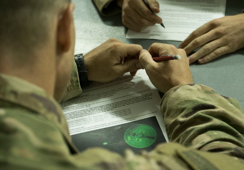 U.S. Army Spc. Austin Mellon, a cavalry scout assigned to Charlie Troop, 1st of the 124th Cavalry, U.S. Army Central, answers land navigation questions during U.S. Army Central's 2018 Best Warrior Competition at Forward Operating Base Gerber, Kuwait, June 29, 2018. To be capable in a rapidly changing battlefield, Soldiers must be mentally sharp and able to think quickly.