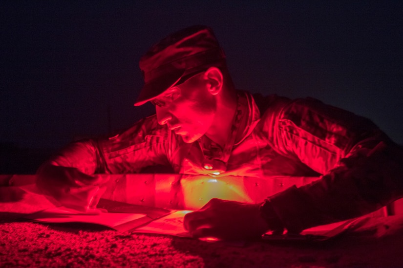 U.S. Army Spc. Alexander Dillon, a military policeman assigned to the 202nd Military Police Company, attached to U.S. Army Central, plots his points for the land navigation event during U.S. Army Central's 2018 Best Warrior Competition at Forward Operating Base Gerber, Kuwait, June 29, 2018. To be capable in a rapidly changing battlefield, Soldiers must be mentally sharp and able to think quickly.