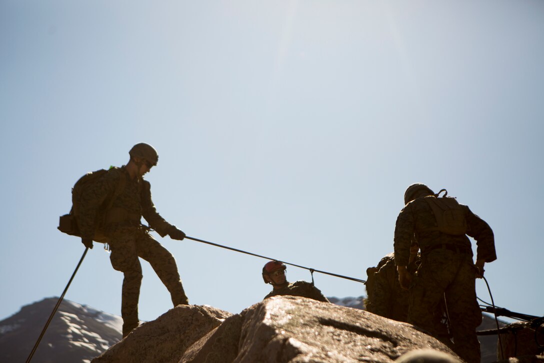 Marines with 2nd Battalion, 24th Marine Regiment, 23rd Marines, 4th Marine Division, begin their preparations of rappelling down a cliffside, during Mountain Exercise 3-18, at Mountain Warfare Training Center, Bridgeport, Calif., June 22, 2018. After completing Integrated Training Exercise 4-17 last year, 2nd Bn., 24th Marines took part in MTX 3-18 to further develop small-unit leadership and build an understanding of the different climates and scenarios they could face in the future.