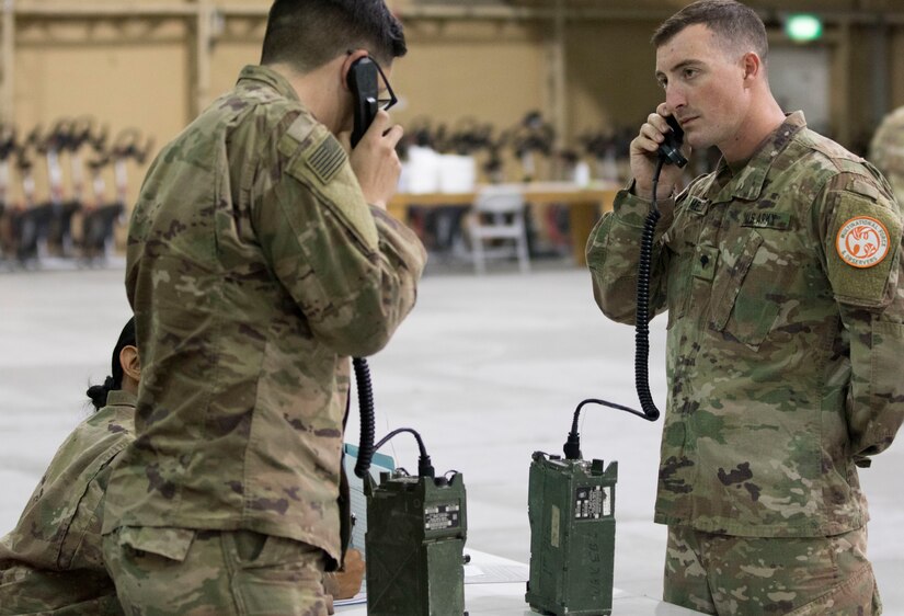 U.S. Army Spc. Austin Mellon, a cavalry scout assigned to Charlie Troop, 1st of the 124th Cavalry, U.S. Army Central, conducts a radio check with a grader as part of Warrior Skills testing at USARCENT's Best Warrior Competition at Camp Arifjan, Kuwait, June 28, 2018. Setting up a radio for long distance communication is a basic Warrior Skill that is essential for all Soldiers to be proficient in so they will be combat ready at all times.