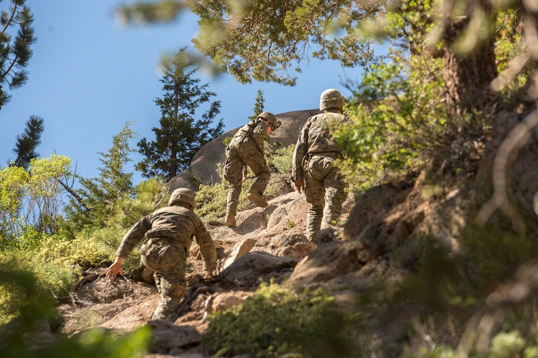 Marines with 2nd Battalion, 24th Marine Regiment, 23rd Marines, 4th Marine Division, hike up to a rally point to rappel down a cliffside, during Mountain Exercise 3-18, at Mountain Warfare Training Center, Bridgeport, Calif., June 22, 2018. After completing Integrated Training Exercise 4-17 last year, 2nd Bn., 24th Marines took part in MTX 3-18 to further develop small-unit leadership and build an understanding of the different climates and scenarios they could face in the future.