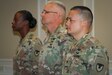 Col. Kim M. Thomas (background), outgoing commander of the 408th Contracting Support Brigade, Brig. Gen. Paul H. Pardew (center), commanding general, U.S. Army Contracting Command, and Col. Ralph T. Borja, incoming commander of the 408th CSB, stand at attention during the 408th’s change-of-command ceremony at the Carolina Skies Club and Conference Center at Shaw Air Force Base, South Carolina, June 22, 2018.