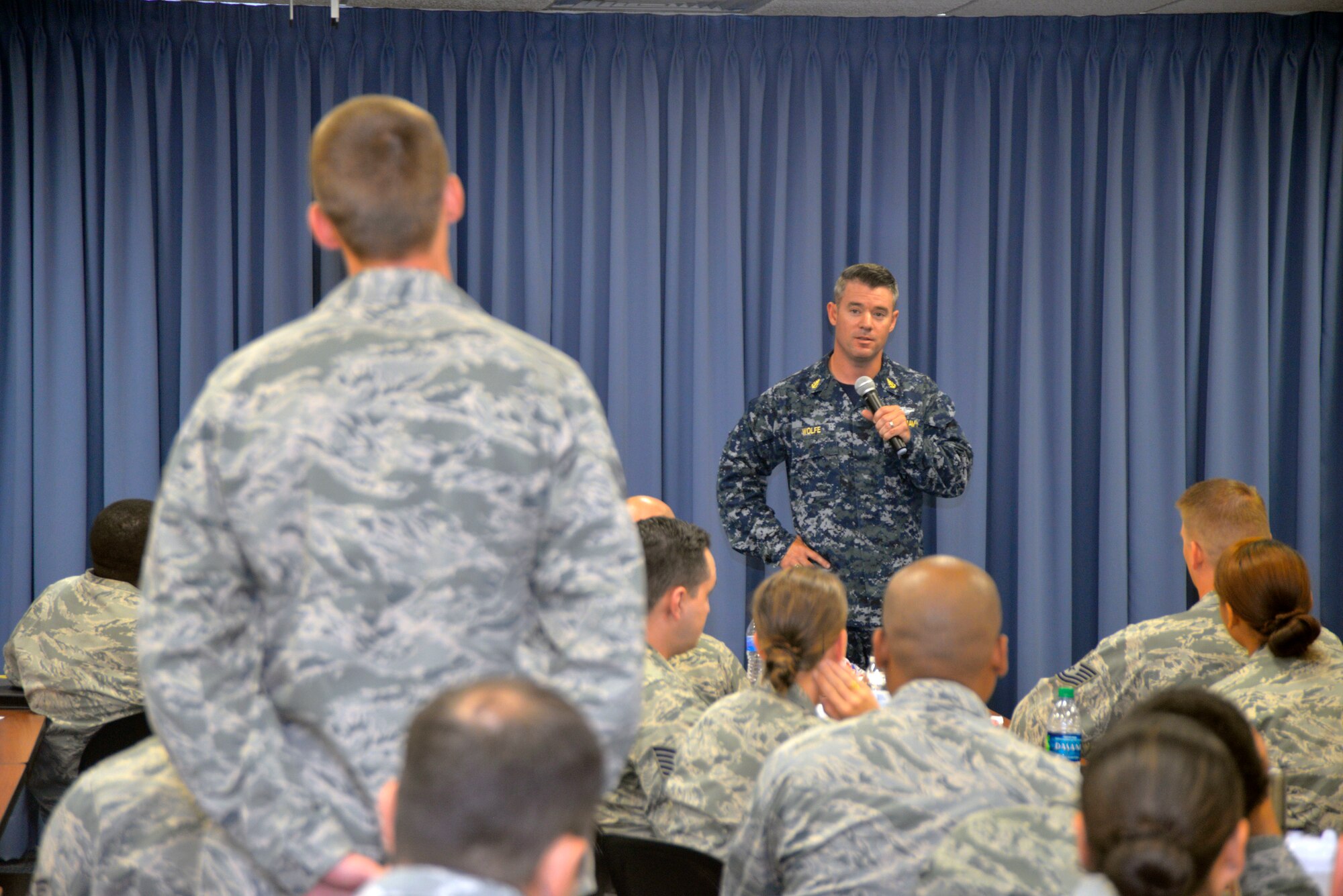 Navy Senior Chief Petty Officer Trevor Wolfe, U.S. Transportation Command Command Surgeon's Office, answers a question at the Scott Air Force Base Senior NCO Professional Enhancement Course on Scott AFB June 28, 2018.