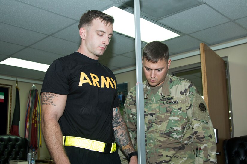 U.S. Army Spc. Cameron Gaylor, a healthcare specialist assigned to Army Support Group - Kuwait, weighs in during registration for the 2018 U.S. Army Central Best Warrior Competition at Camp Arifjan, Kuwait, June 27, 2018. The best warrior competition is held to promote morale and cohesion, and to reinforce the importance of individual excellence within the profession.