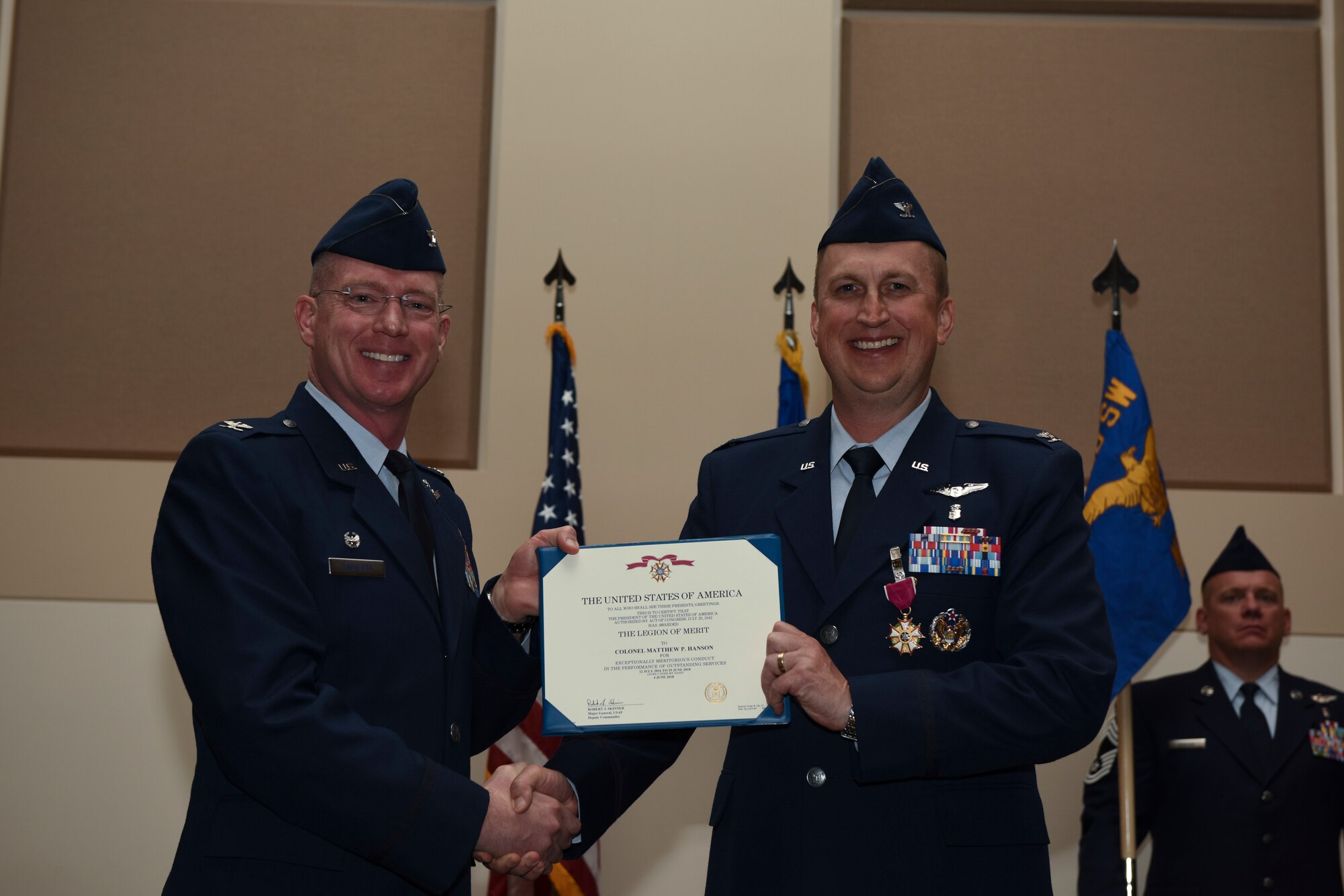 Col. Troy Endicott, 460th Space Wing commander, presents the Legion of Merit to Col. Matthew Hanson, 460th Medical Group commander, June 29, 2018, on Buckley Air Force Base, Colorado. Hanson will be attending U.S. Air Force Air War College after his departure from Buckley AFB. (U.S. Air Force photo by Airman 1st Class Michael D. Mathews)