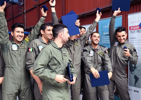 The Afghan Air Force’s newest pilots hold up their certificates in celebration after having graduated from Initial Entry Fixed-Wing school at LOM Praha’s flight training center, Czech Republic, June 27, 2018. The graduates will return to Afghanistan this week to either continue their training on one of the AAF platforms there.